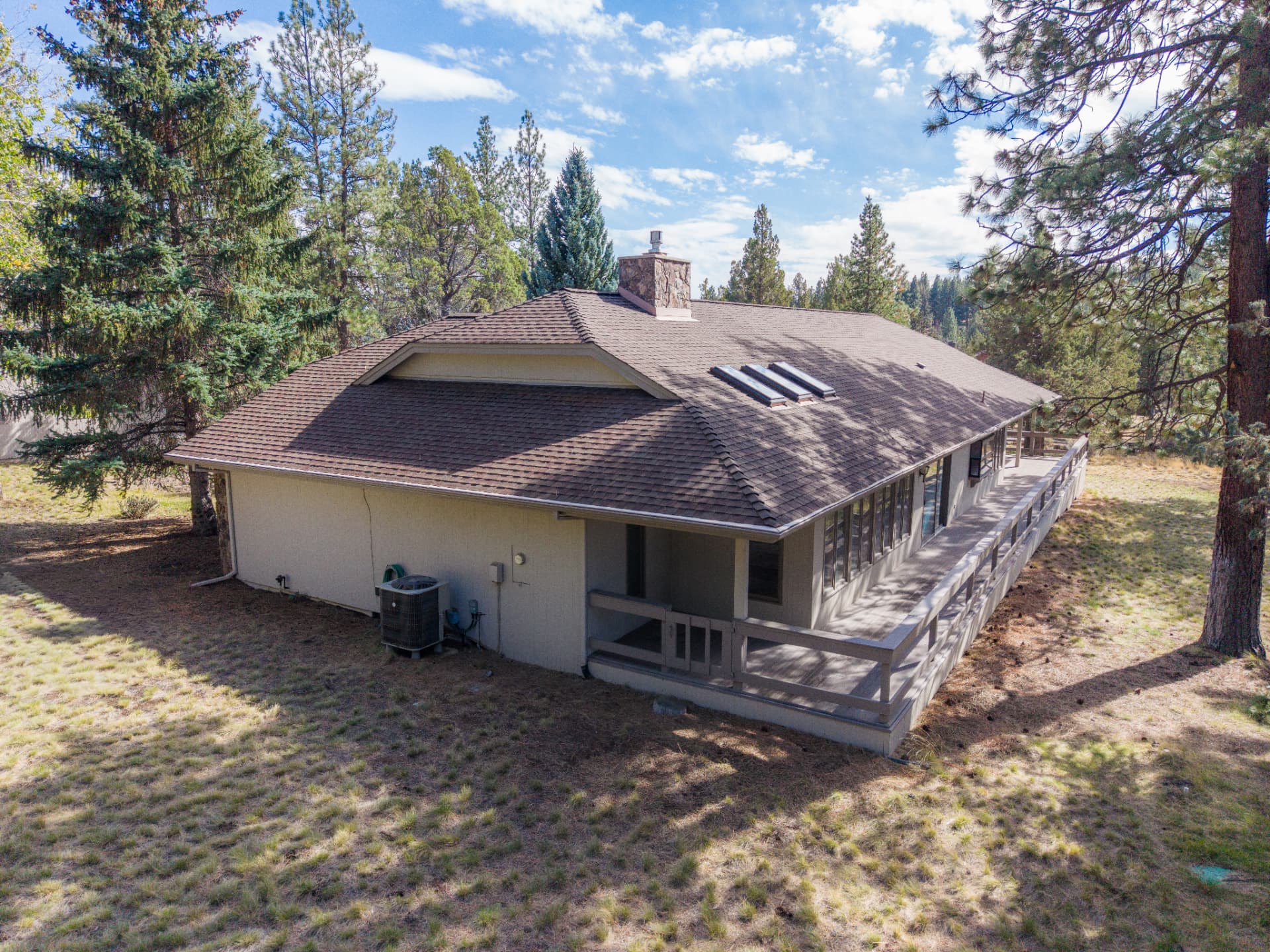 Wooded home exterior aerial view
